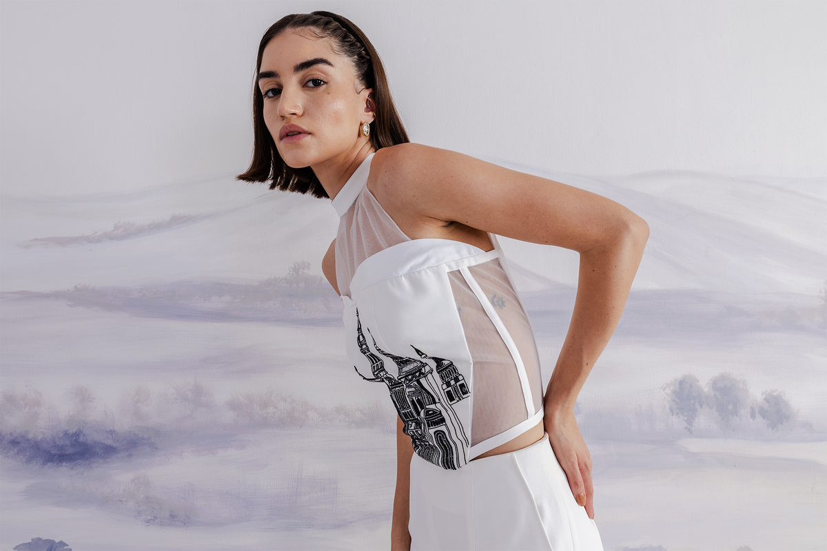 Woman wearing a structured corset with high-waist flared trousers by Orthodox Design